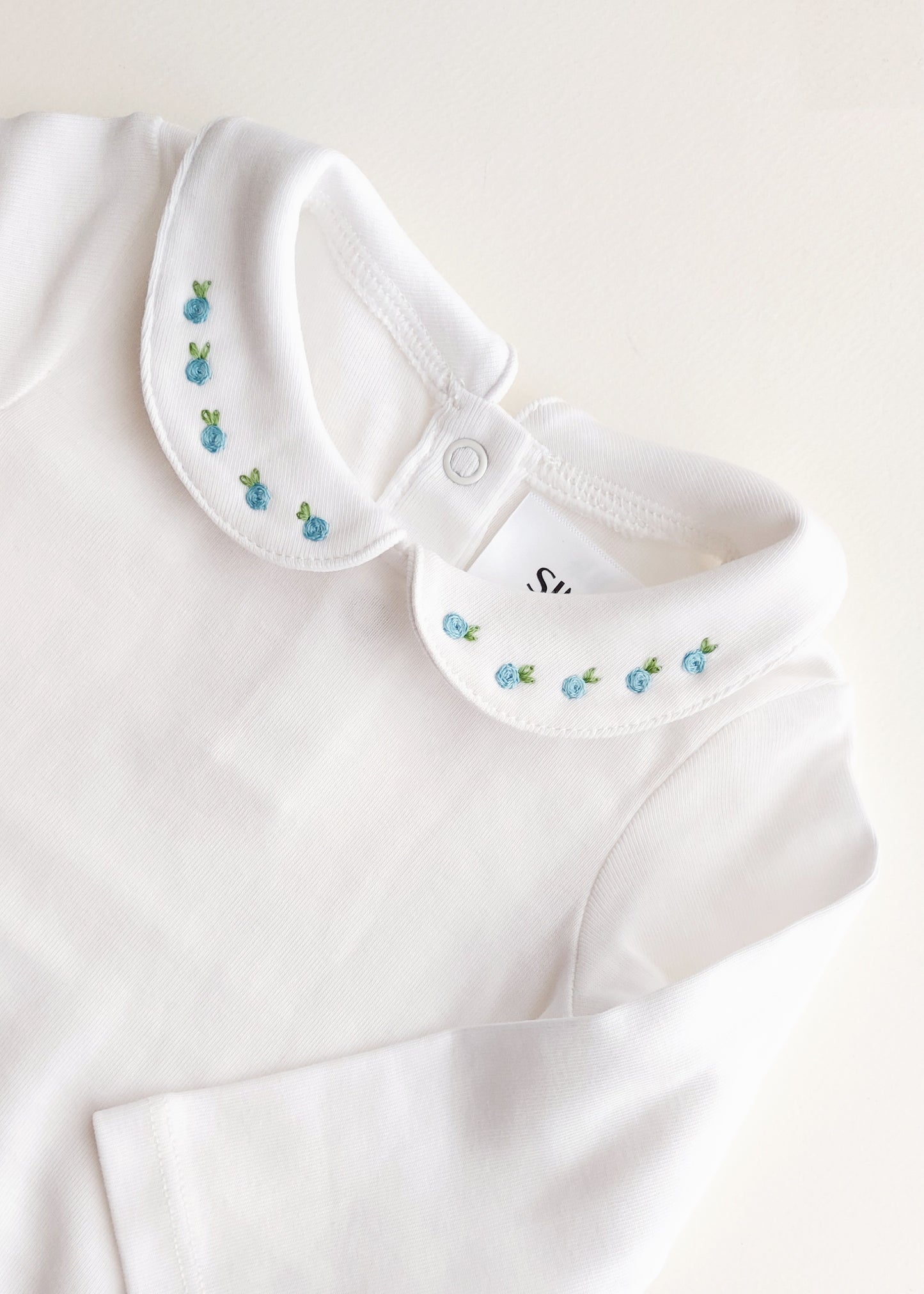 Body con colletto ricamato minimal fiori